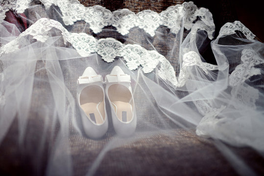 Beautiful colorful wedding shoes for bride indoors. Beauty of bridal heel for marriage. Female couple boots for celebration