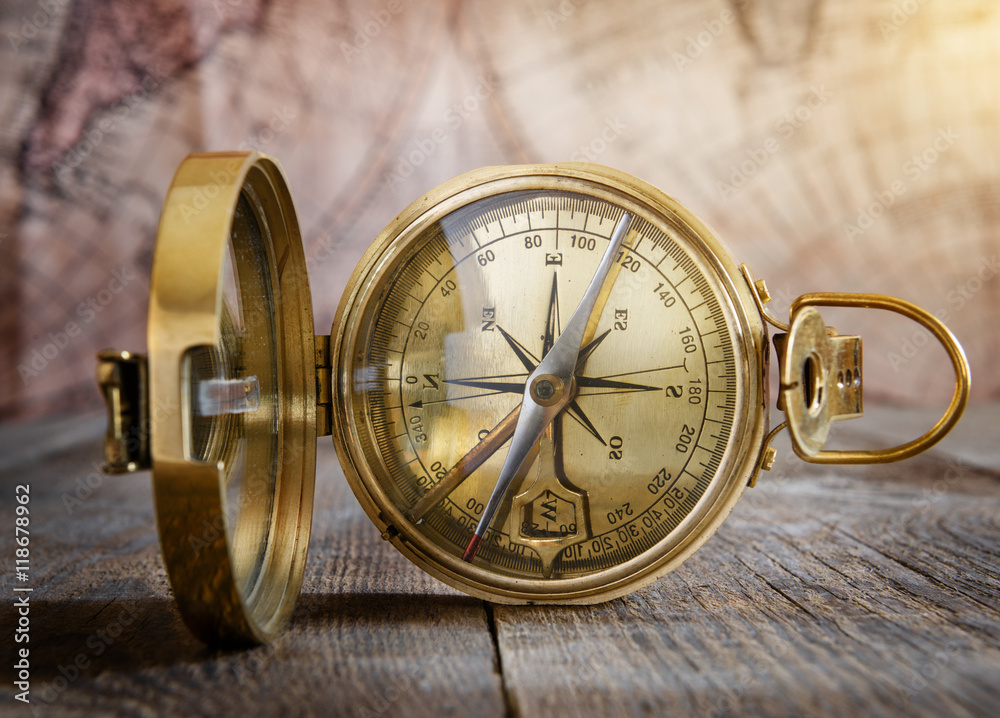Poster old compass on the vintage map background. retro style.