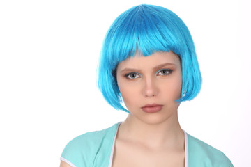 Lady wearing blue wig and T-shirt. Close up. White background