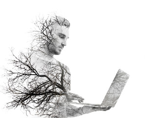 Young man using laptop, isolated on white