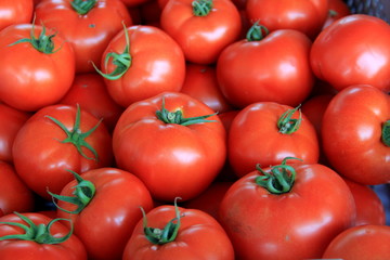 Group of large,juicy tomatoes on sale at local farmers market.