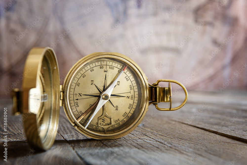 Poster old compass on the vintage map background. retro style.