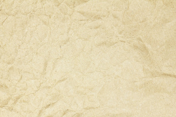 Recycled crumpled brown paper texture or paper background for design with copy space for text or image.