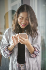 asian younger woman laughing with happiness emotion looking and