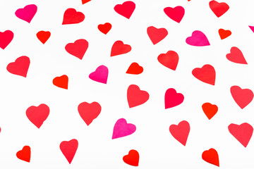 pink and red hearts cut out from paper on white