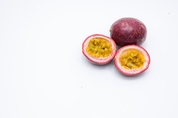 Passion fruit and two half isolated on a white background.