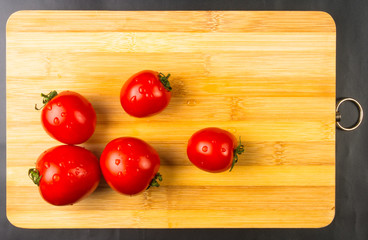 omatoes on wooden background