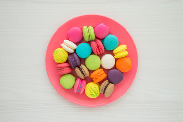 Colorful france macarons on white table background
