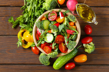 Natural vegetable salad with cucumbers, tomatoes and broccoli