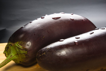 eggplants on wooden Board