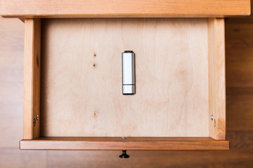 closed flash drive in open drawer
