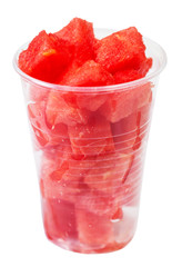 plastic glass with diced ripe watermelon isolated