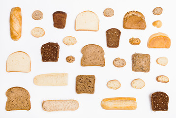 various sliced bread loaves and rolls on white