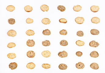 many sliced bread baguettes on white