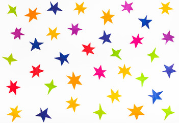 top view of various stars cut out from color paper