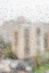 view of raindrops on window of apartment house