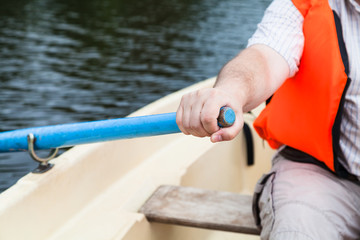 paddler with oar on boat during water walk