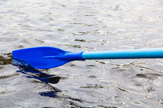 paddle blade in water during boating
