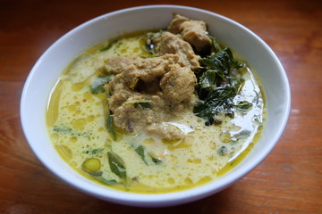 green curry chicken in coconut milk in bowl

