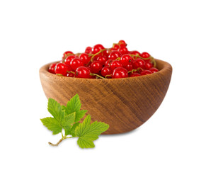 Redcurrant in a wooden bowl isolated on white background.
