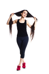 Fototapeta premium Attractive fit female athlete in sportswear, full body studio po