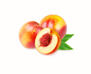 Peaches (nectarine) isolated on white. Peaches with leaves.