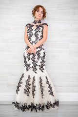 Portrait of a beautiful girl in a beautiful dress with patterns by Parliament