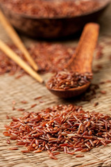 red rice  on a straw background