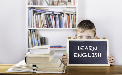 Learn English. Boy holding blackboard