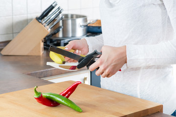 close-up of sliced banana with a kitchen knife with scissors