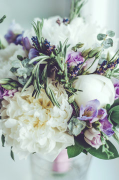 Beautiful tender wedding bouquet. Provence flowers. Bridal white peony with violet freesia, lilac lavender, roses. Rustic style. Bridal symbol, pastel colors. Selective soft focus.