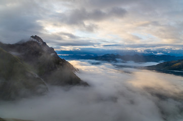 Beautiful sunrise with clouds and fog in the mountains, Austria