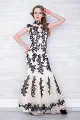 Portrait of a beautiful girl in a beautiful dress with patterns by Parliament