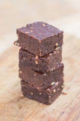 Homemade chocolate brownies over wooden background