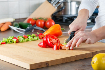 closeup sliced sweet pepper with a kitchen knife, scissors