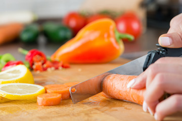 closeup sliced carrot with a kitchen knife