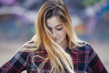 blonde woman with her hair blown by the wind