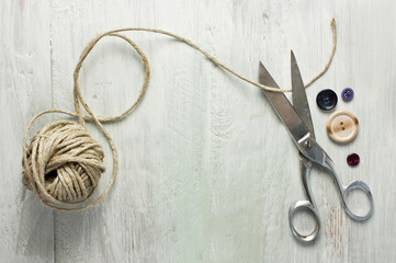 Vintage scissors, roll of twine and buttons, with copyspace