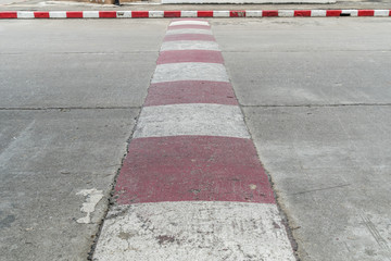 Concrete road with red and white sign