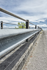 Safety metal guardrail on a rural roadside