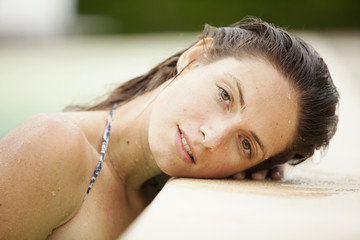 Young attractive woman in swimming pool