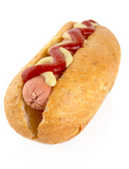 Hot dog with mustard and ketchup isolated on white