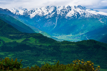 Svaneti, Georgia - mountain panorama. View of wooded and snow-capped mountains
