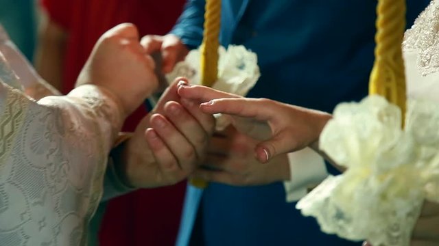 traditional Ukrainian wedding ceremony of gentle happy gorgeous couple, old church