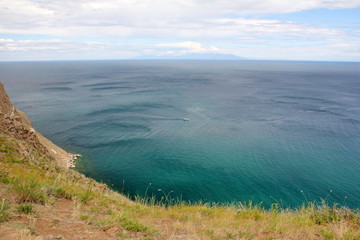 beautiful nature of lake in the summer, high mountains and clear green, purple water of Lake Baikal, Siberia, Russia - landscape