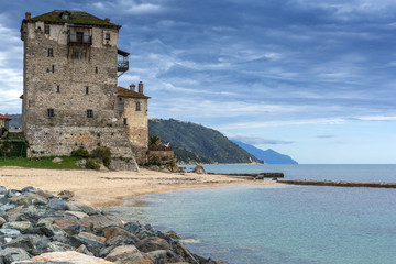 Fototapeta na wymiar Amazing Seascape with Medieval tower in Ouranopoli, Athos, Chalkidiki, Central Macedonia, Greece 
