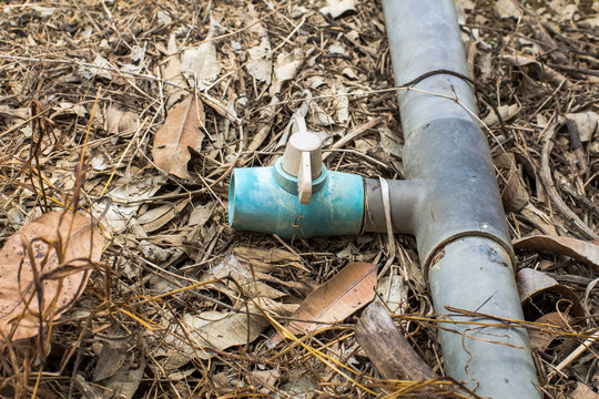 Old spinger and pvc pipe in farmland