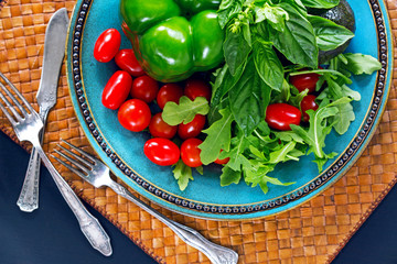 Fresh vegetables, salad arugula, basil, cherry tomatoes, paprika