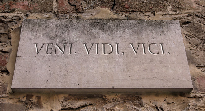 Veni, vidi, vici. A Latin phrase meaning I came, I saw , I conquered. Engraved text.