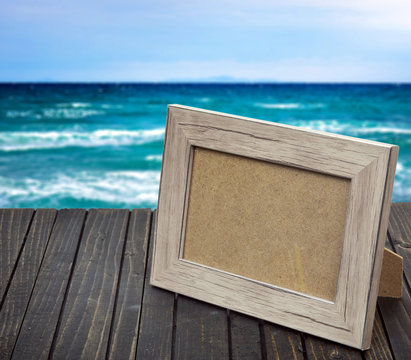 Photo frame on wooden table